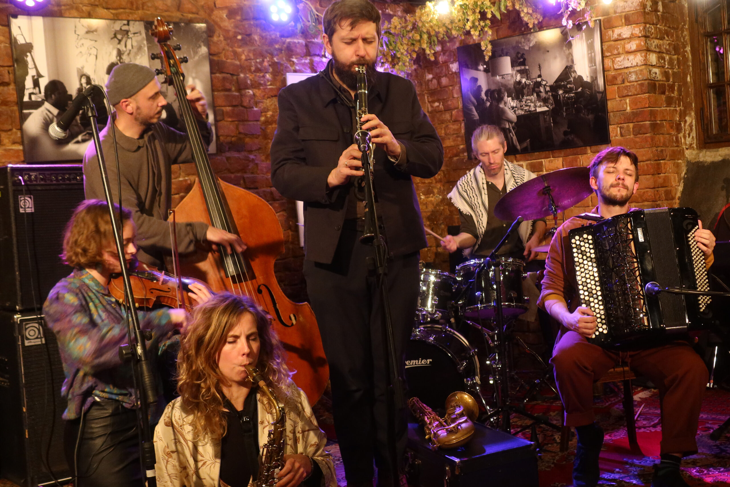 Clockwise from centre: Mateusz Rybisk (multiple reeds); Matylda Gerber (tenor saxophone): Julia Stein (violin); gniew Kozera (bass): ; Sam Hall (drums); unidentifed accordionist. 